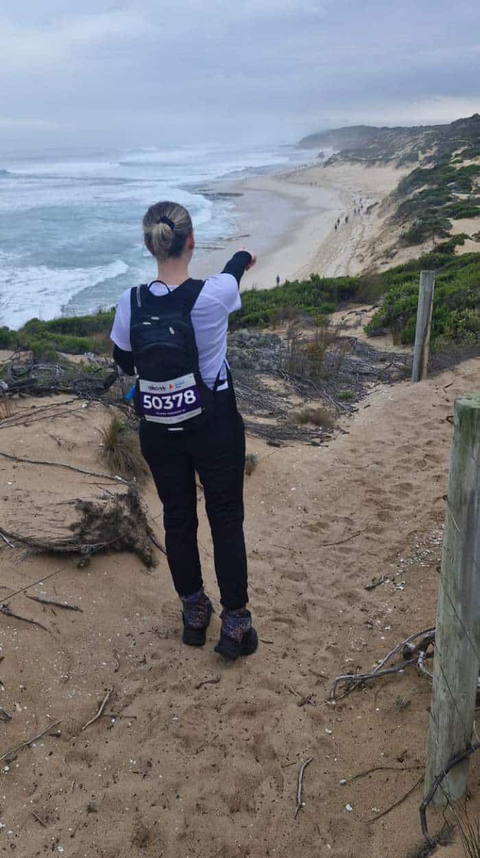 women hiking on beach